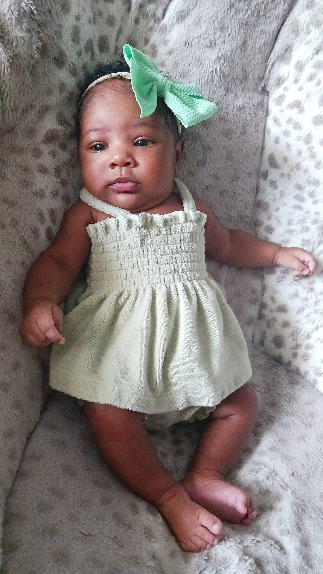 Danielle is registered to the contest to win money with this photo: arm, baby, baby_toddler_clothing, cap, child, costume_hat, day_dress, dress, eyelash, face, fashion_accessory, headgear, headpiece, iris, linens, pattern, person, pink, skin, sleeve