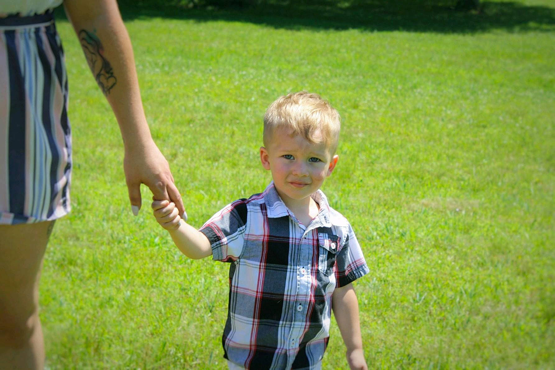 Tyeson is registered to the contest to win money with this photo: child, design, fun, gesture, grass, lawn, leisure, meadow, pattern, person, plaid, plant, play, recreation, summer, toddler, vacation, walking