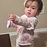 Rynlee joined the competition — help win amazing prizes! toddler, child, baby, portrait, standing, indoors, hairbrush, pink_clothing, pajamas, flower_hair_clip, dark_hair, facial_expression, pointing, hand, carpet, wall, electrical_outlet, furniture, home, photography