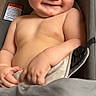 Emiliano is registered to the contest to win money with this photo: baby, smiling, cheeky, car_seat, infant, skin, cute, portrait, child, happy, human, seat, indoors, expression, one_person, young, face, hands, relaxed, comfort