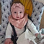 baby, infant, headband, pink, bib, toy, pacifier, babychair, pattern, clothing, cute, smile, hand, face, sitting, indoor, blanket, soft, child, person
