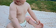 Eliana participe au concours pour gagner de l'argent avec cette photo : baby, infant, diaper, blanket, outdoor, grass, toy, giraffe_toy, pacifier, skin, child, sitting, cute, young, nature, daylight, playing, curious, person, closeup