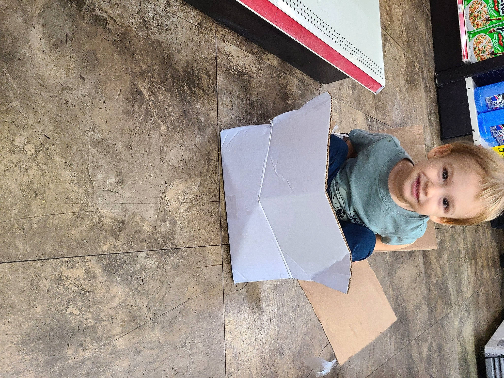 Gionni is registered to the contest to win money with this photo: child, concrete, flooring, font, fun, joy, person, road_surface, smile, street_fashion, t_shirt, toddler, wood