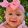 baby, blue_sky, child, closeup, clothing, cute, green_leaves, happy, headband, holding_hands, infant, nature, outdoor, person, pink_bow, portrait, smile, summer, sunlight, tree