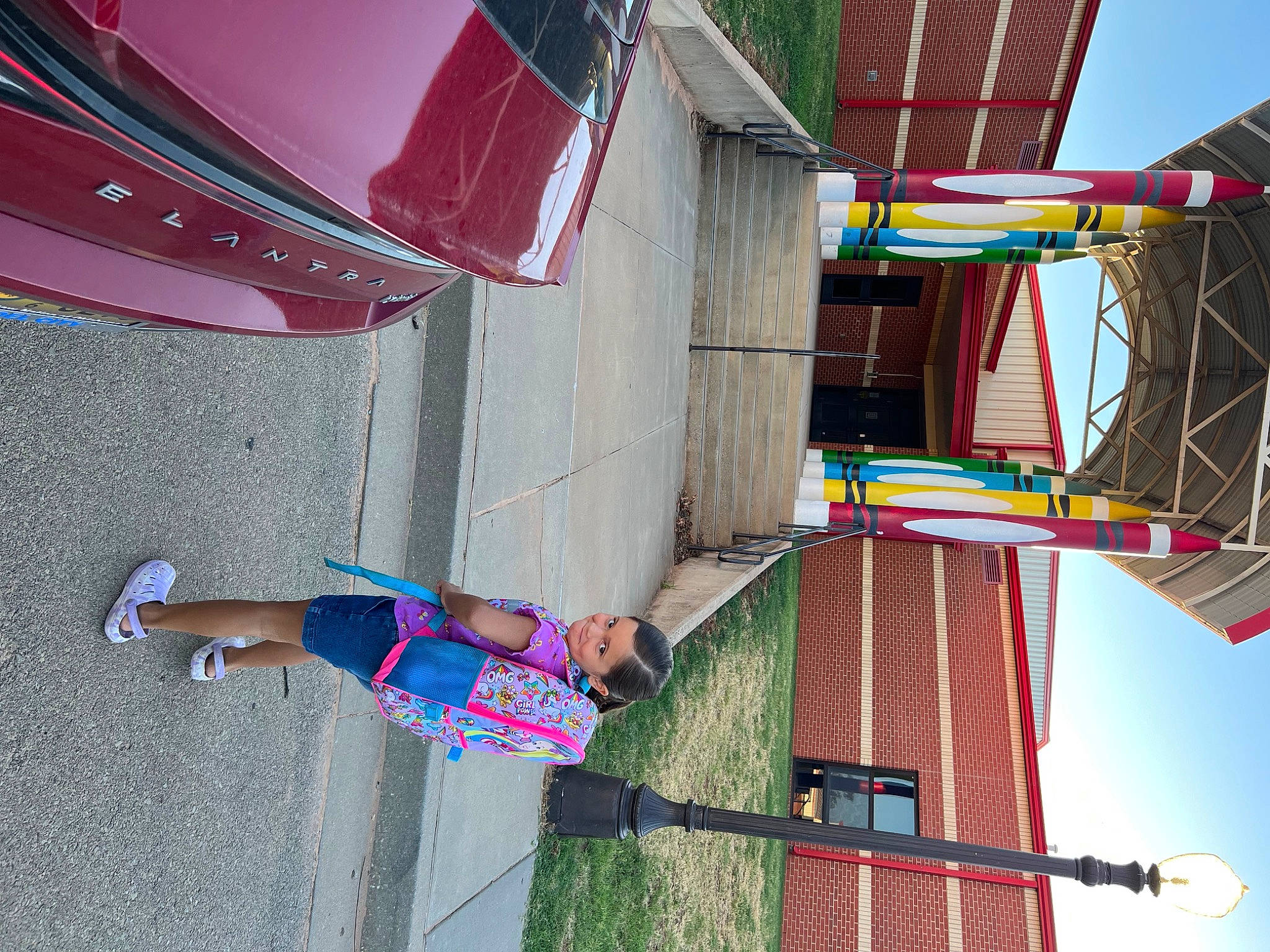 Tatum is registered to the contest to win money with this photo: automotive_lighting, automotive_tail_brake_light, beauty, building, clothing, fun, joy, leisure, light, line, magenta, motor_vehicle, person, photograph, pink, red, sky, snapshot, summer, thigh