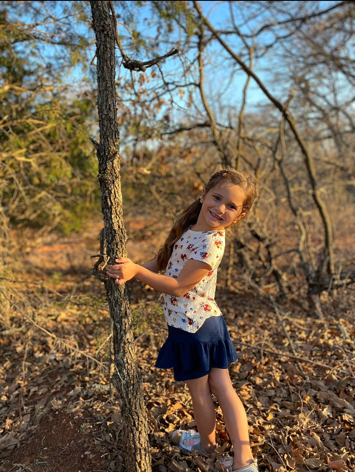Tatum joined the competition — help win amazing prizes! brown_hair, electric_blue, fawn, flash_photography, forest, grass, happy, joy, leisure, long_hair, people_in_nature, person, plant, recreation, sky, soil, toddler, tree, trunk, twig