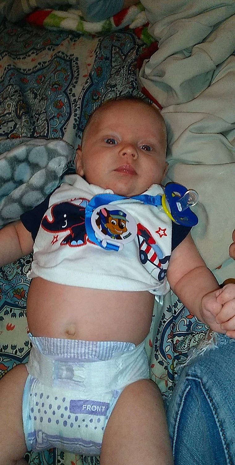 Daniel is registered to the contest to win money with this photo: arm, azure, baby, baby_toddler_clothing, cheek, eye, face, finger, hand, head, iris, mouth, organ, person, product, skin, stomach, textile, thigh, waist