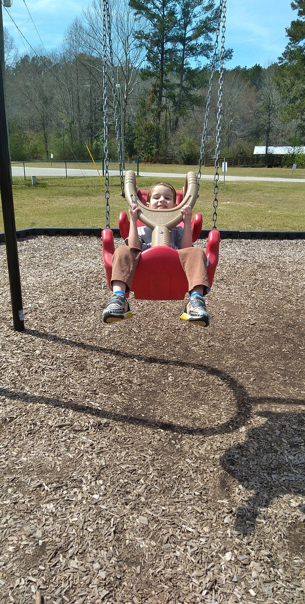 Thomas joined the competition — help win amazing prizes! asphalt, boot, carmine, city, footwear, fun, grass, human_leg, leisure, outdoor_play_equipment, person, plant, playground, recreation, sitting, sneakers, soil, swing, toddler, toy