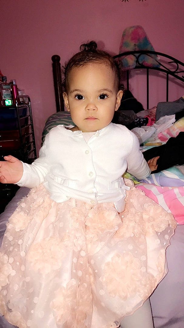 Alianna is registered to the contest to win money with this photo: baby, cheek, child, clothing, costume, dress, eye, head, iris, person, pink, skin, toddler