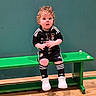 Harrison joined the competition — help win amazing prizes! bench, black_outfit, child, curly_hair, curly_hair_child, cute, expression, floor, green_bench, indoor, sitting, soccer_ball, socks, sportswear, teal_ball, toddler, white_shoes, wide_eyes, wooden_floor, young_child