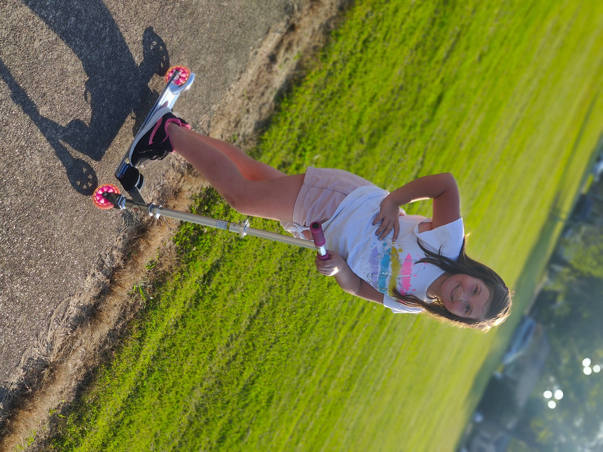 Jamie is registered to the contest to win money with this photo: adventure, asphalt, extreme_sport, fun, grass, happy, joy, landscape, leisure, outdoor_shoe, people_in_nature, person, plant, recreation, shadow, slope, soil, sports, tree, walking_shoe