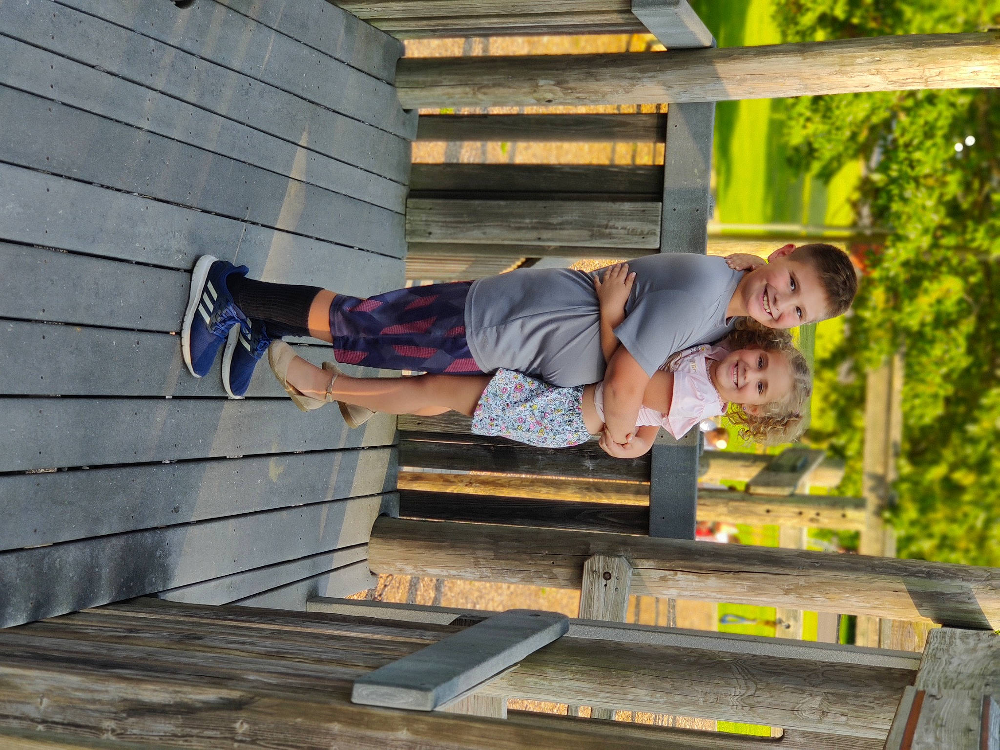 Grace joined the competition — help win amazing prizes! child, composite_material, fun, happy, human_leg, joy, leisure, person, recreation, shorts, sitting, smile, t_shirt, tree, vacation, wood