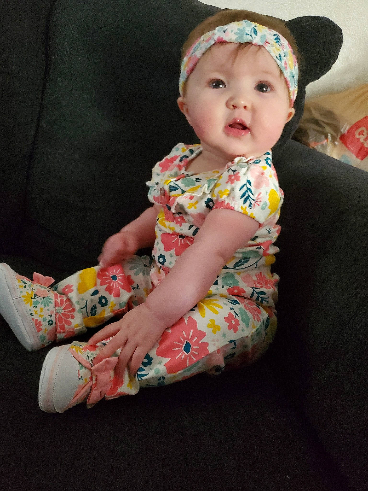 Brooklynn is registered to the contest to win money with this photo: baby, cheek, child, dress, hair_accessory, headgear, pattern, person, sitting, skin, textile, toddler