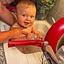 Andréa participe au concours pour gagner de l'argent avec cette photo : baby, bath, blond_hair, blue_eyes, child, clean, countertop, cute, domestic, hands, happy, herbs, kitchen, person, red_pan, sink, skin, smiling, utensils, water