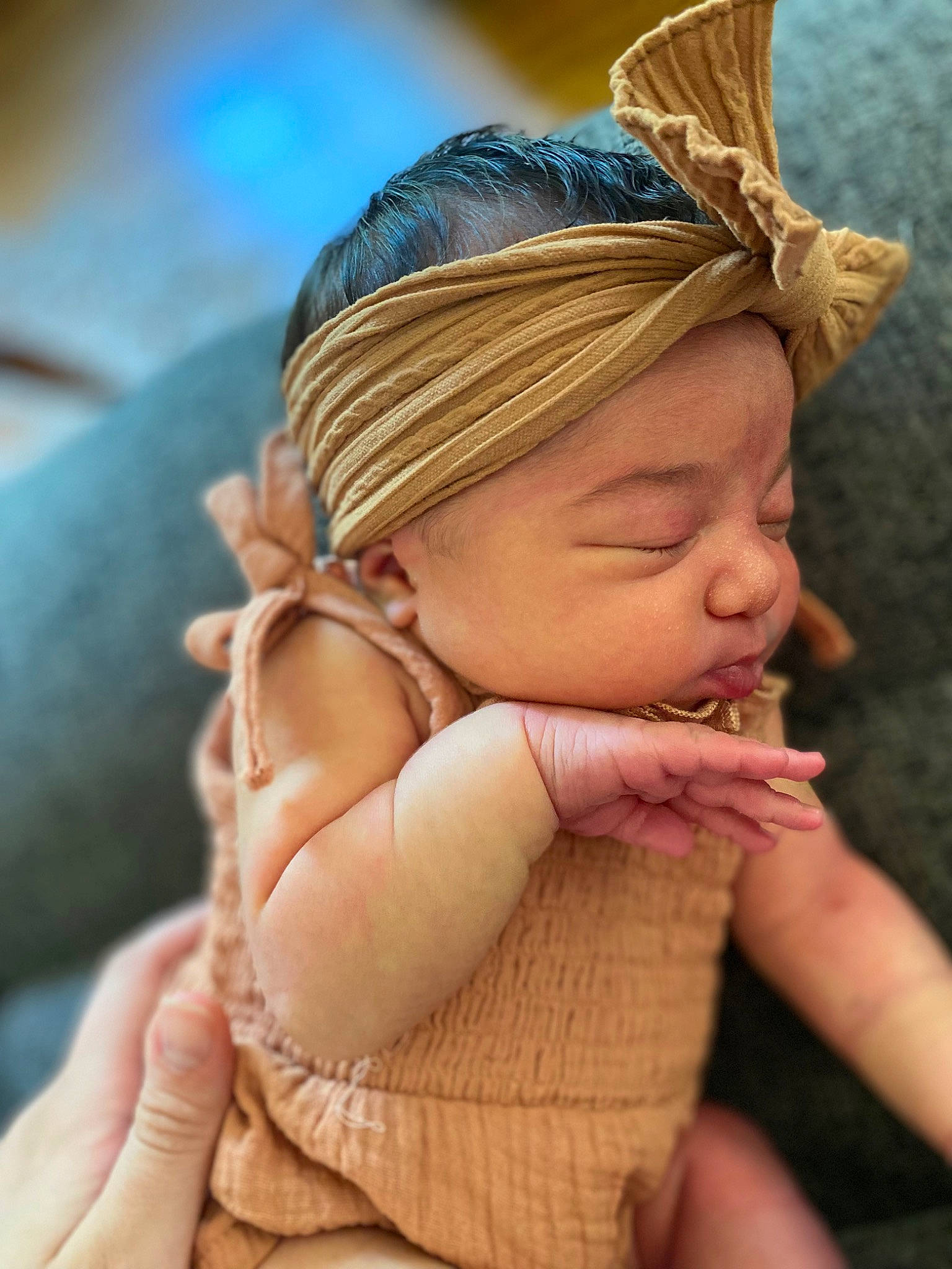 Juniper is registered to the contest to win money with this photo: baby, cap, dress, eye, eyelash, facial_expression, finger, gesture, grass, hand, happy, head, headgear, headpiece, iris, lip, mouth, neck, person, skin