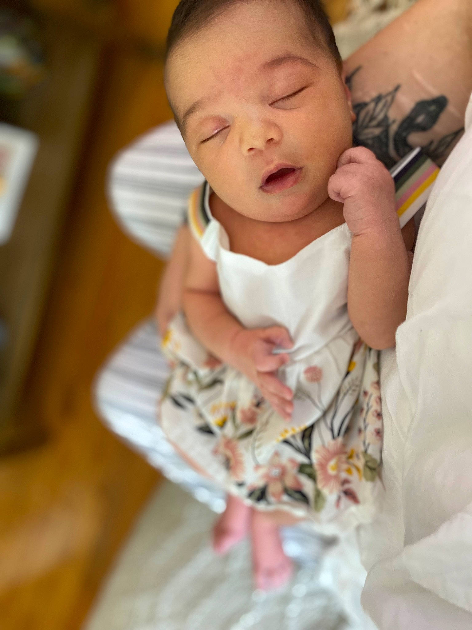 Juniper is registered to the contest to win money with this photo: baby, baby_toddler_clothing, cheek, child, comfort, dress, event, eye, eyelash, face, gesture, hair, happy, head, human_body, linens, person, skin, sleeve, thumb