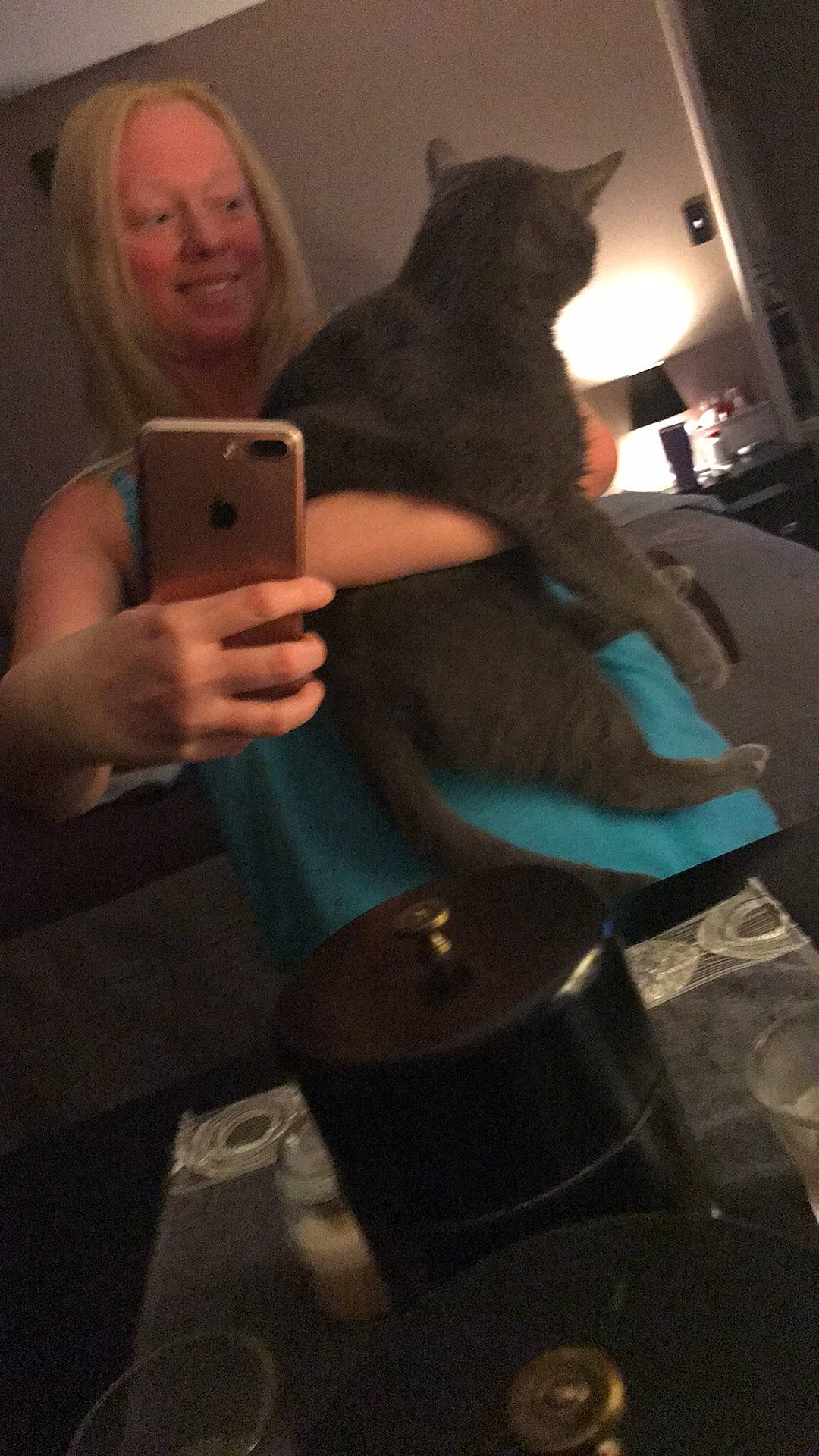 Grayson is registered to the contest to win money with this photo: audio_equipment, blond, cat, communication_device, elbow, electric_blue, facial_expression, felidae, finger, fun, gadget, hairstyle, human, long_hair, mobile_phone, portable_communications_device, small_to_medium_sized_cats, thigh, thumb, whiskers