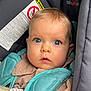 baby, blue_eyes, car_seat, child, close_up, curious, cute, face, infant, padded_straps, pink_clothing, portrait, seatbelt, sitting, soft_texture, warning_label, young_child, indoor, person, looking_at_camera