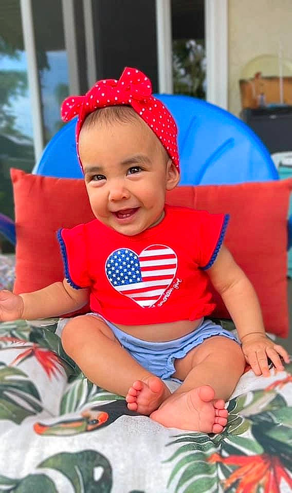 Ailani joined the competition — help win amazing prizes! baby, baby_toddler_clothing, cap, child, costume_hat, electric_blue, event, fictional_character, fun, happy, headgear, joy, lap, leisure, person, pink, purple, recreation, red, sleeve