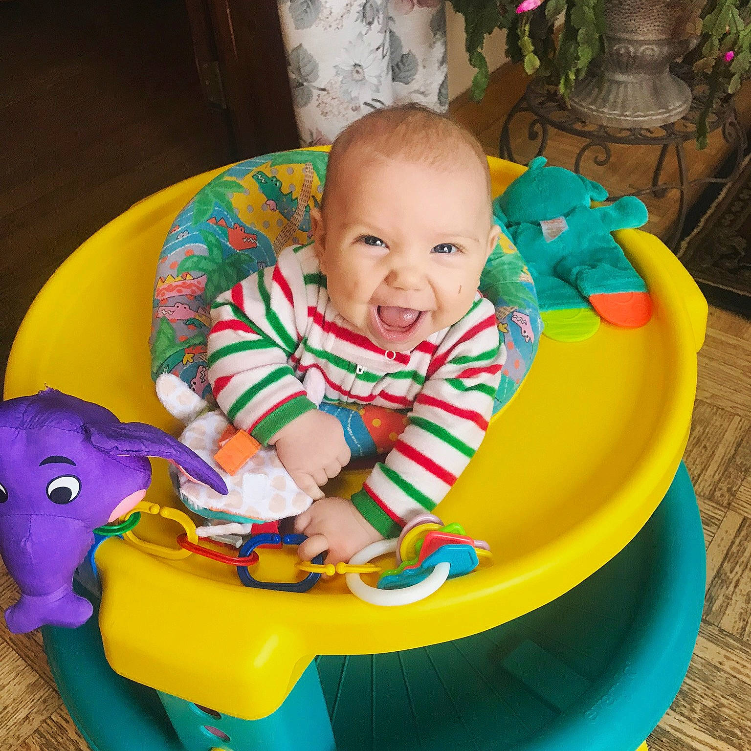 Odin is registered to the contest to win money with this photo: baby_products, baby_toys, child, fun, infant, inflatable, joy, leisure, outdoor_play_equipment, person, play, product, recreation, sitting, smile, toddler, toy, yellow