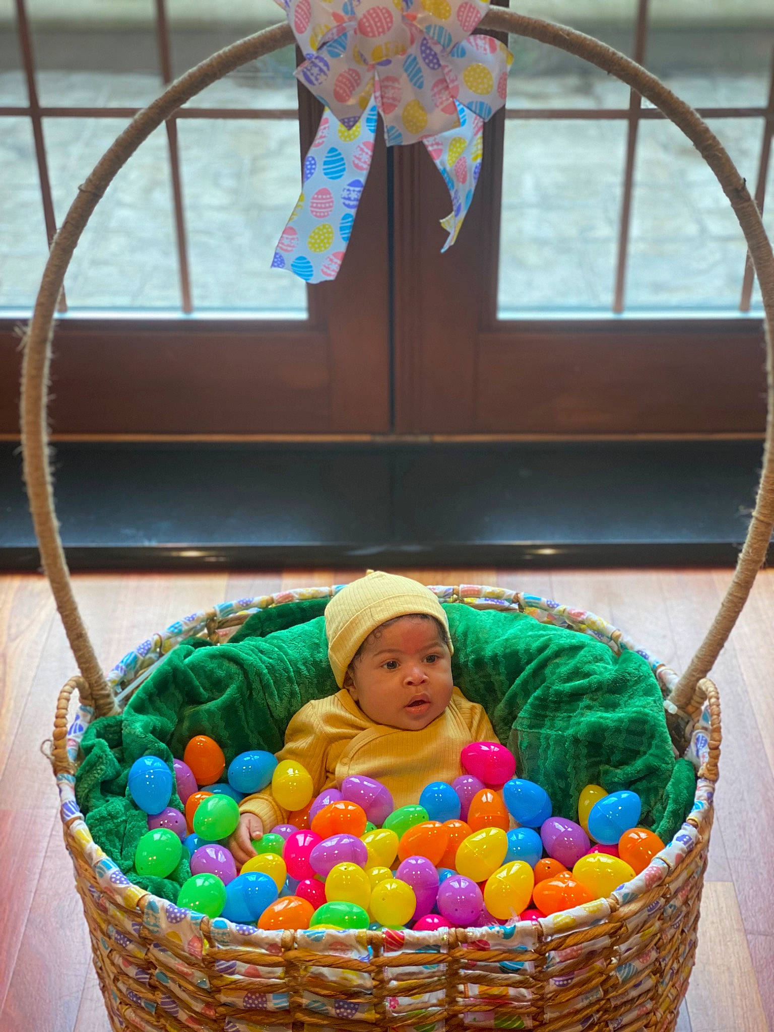 Jericho is registered to the contest to win money with this photo: basket, blue, child, easter, event, headwear, holiday, home_accessories, local_food, natural_foods, person, play, recreation, room, stained_glass, storage_basket, sweetness, textile, toy, wicker