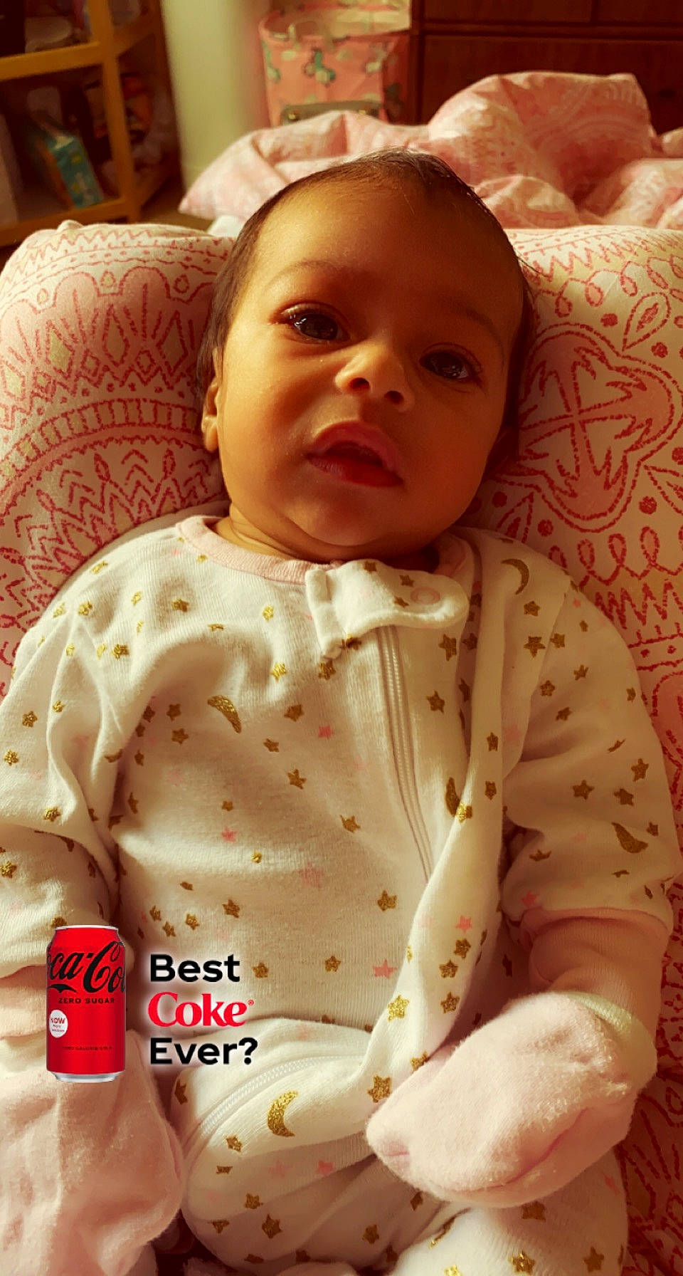 Jazlyn is registered to the contest to win money with this photo: baby, baby_toddler_clothing, bedding, cheek, child, comfort, eye, eyebrow, happy, human_body, linens, lip, neck, nose, person, room, skin, sleeve, smile, textile