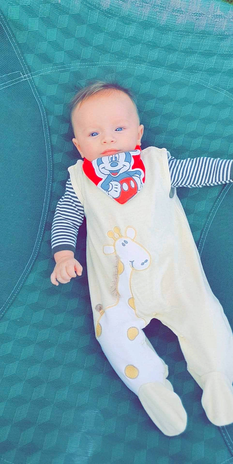 Lisandro participe au concours pour gagner de l'argent avec cette photo : azure, baby, baby_products, baby_safety, baby_toddler_clothing, baby_toys, blue, carmine, child, linens, outerwear, pattern, person, room, sitting, sleeve, stuffed_toy, t_shirt, textile, toddler