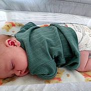 Austin Jr is registered to the contest to win money with this photo: baby, sleeping, green_clothing, diaper, blanket, crib, infant, teddy_bear_pattern, soft_texture, cute, peaceful, child, indoors, rest, cozy, sock, newborn, nap, cute_clothing, baby_bedding