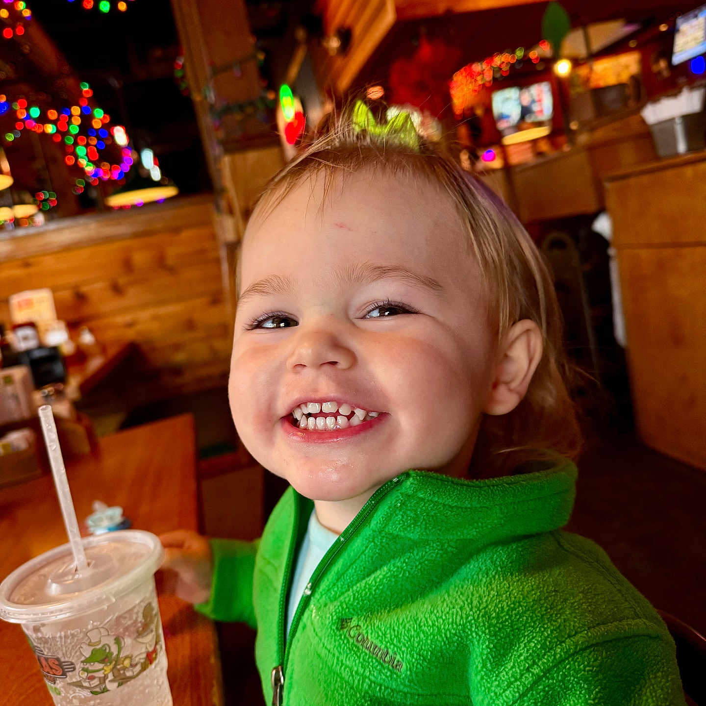 Delainey is registered to the contest to win money with this photo: baby, beverage, computerhardware, cup, electronics, face, hardware, hardwood, head, indoors, juice, monitor, person, photography, plate, portrait, restaurant, screen, tv, wood