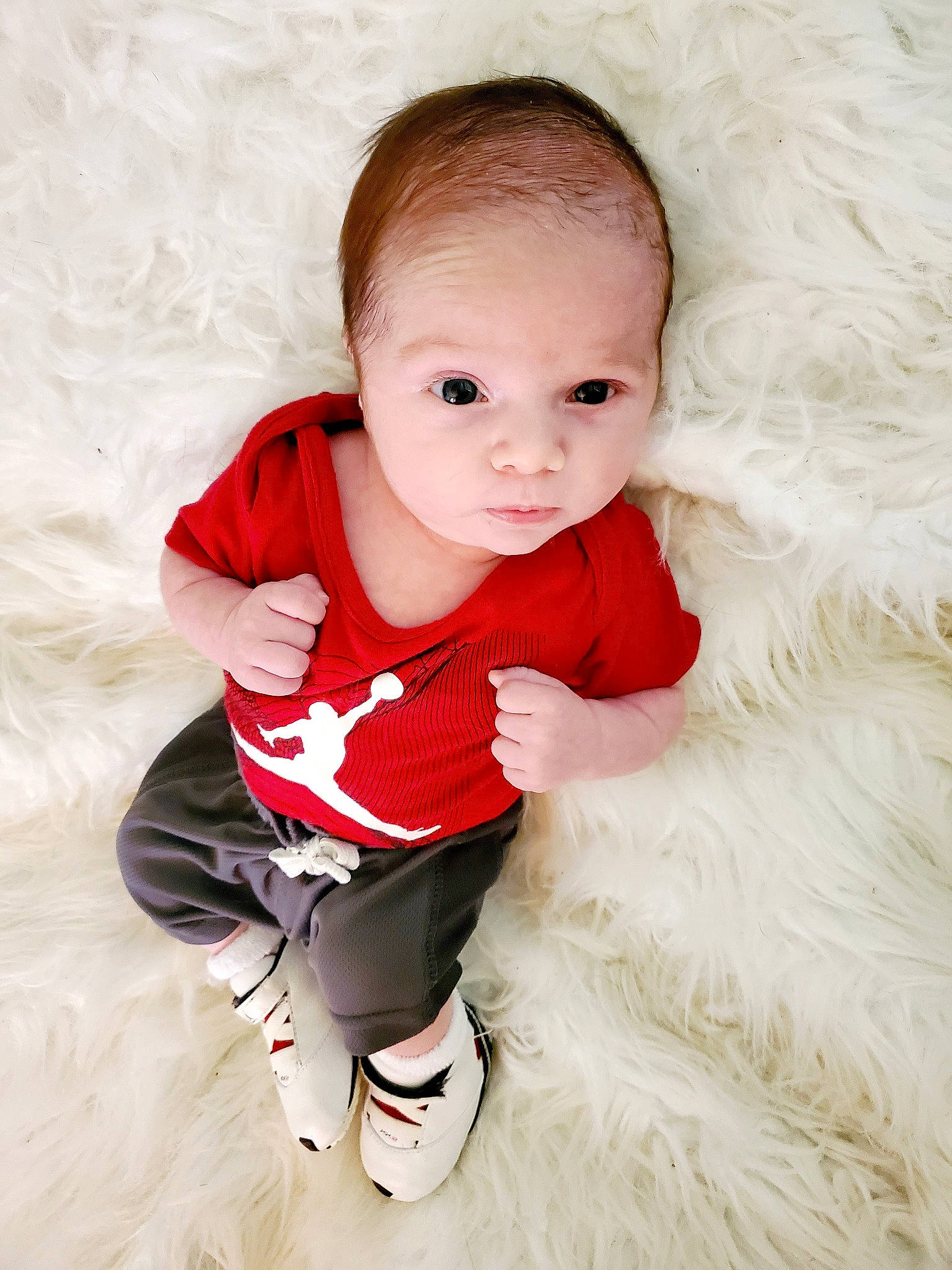 Braylon is registered to the contest to win money with this photo: baby, baby_toddler_clothing, cheek, child, flash_photography, flooring, fur, happy, human_leg, iris, pattern, person, pink, portrait_photography, sitting, skin, sleeve, sock, t_shirt, textile