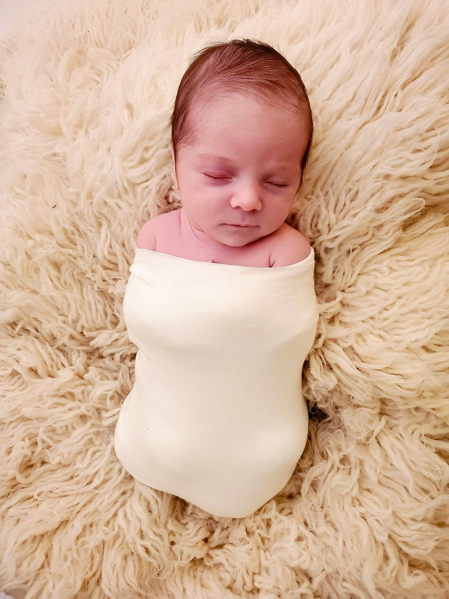 Braylon is registered to the contest to win money with this photo: arm, baby, baby_toddler_clothing, dress, eye, fashion_accessory, fashion_design, flash_photography, fur, grass, happy, headgear, human_body, iris, lip, neck, peach, person, sitting, sleeve