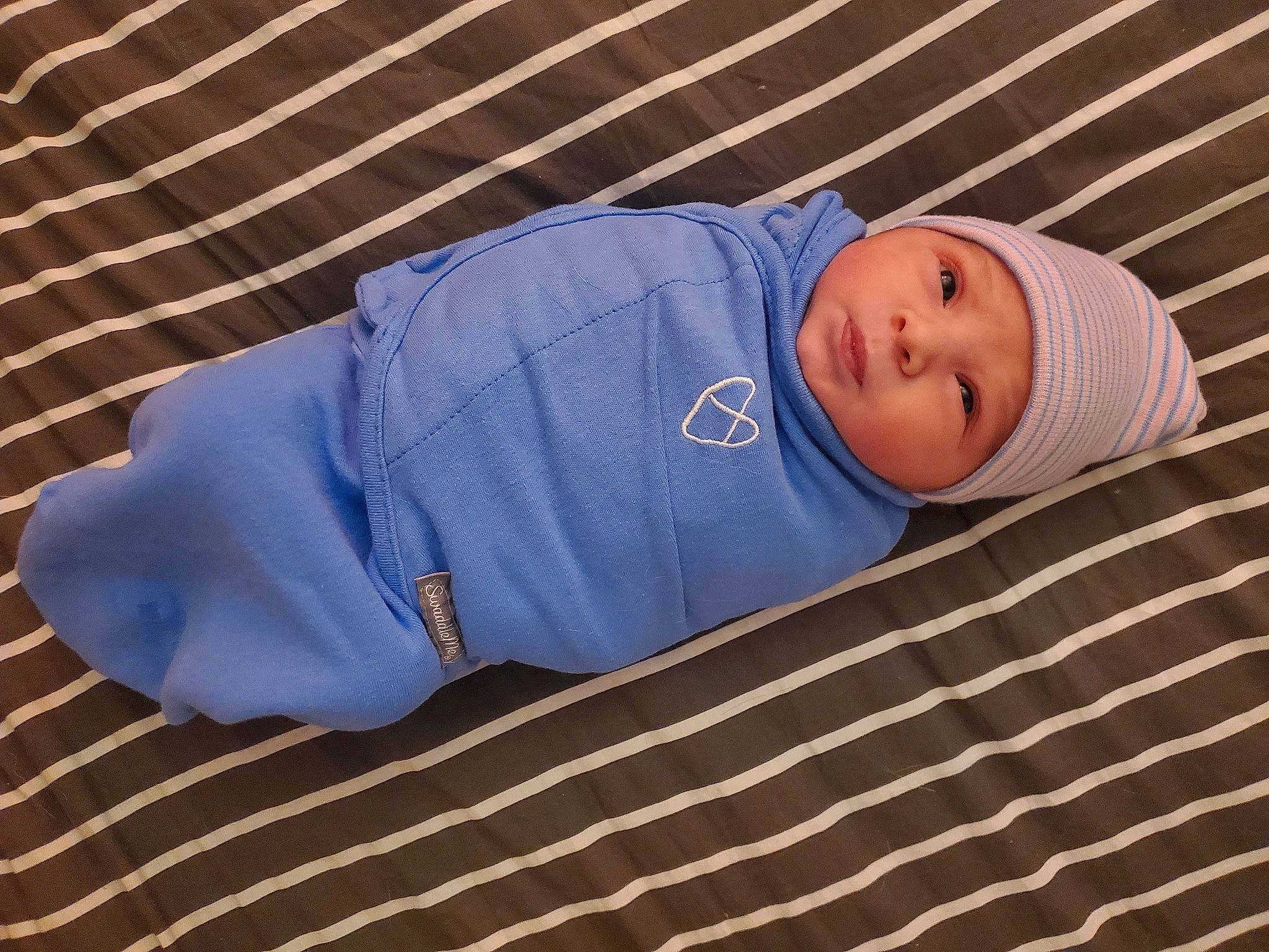 Braylon is registered to the contest to win money with this photo: baby, baby_products, baby_safety, baby_sleeping, baby_toddler_clothing, bedtime, child, comfort, couch, elbow, electric_blue, headwear, linens, nap, pattern, person, room, sleep, sleeve, toddler