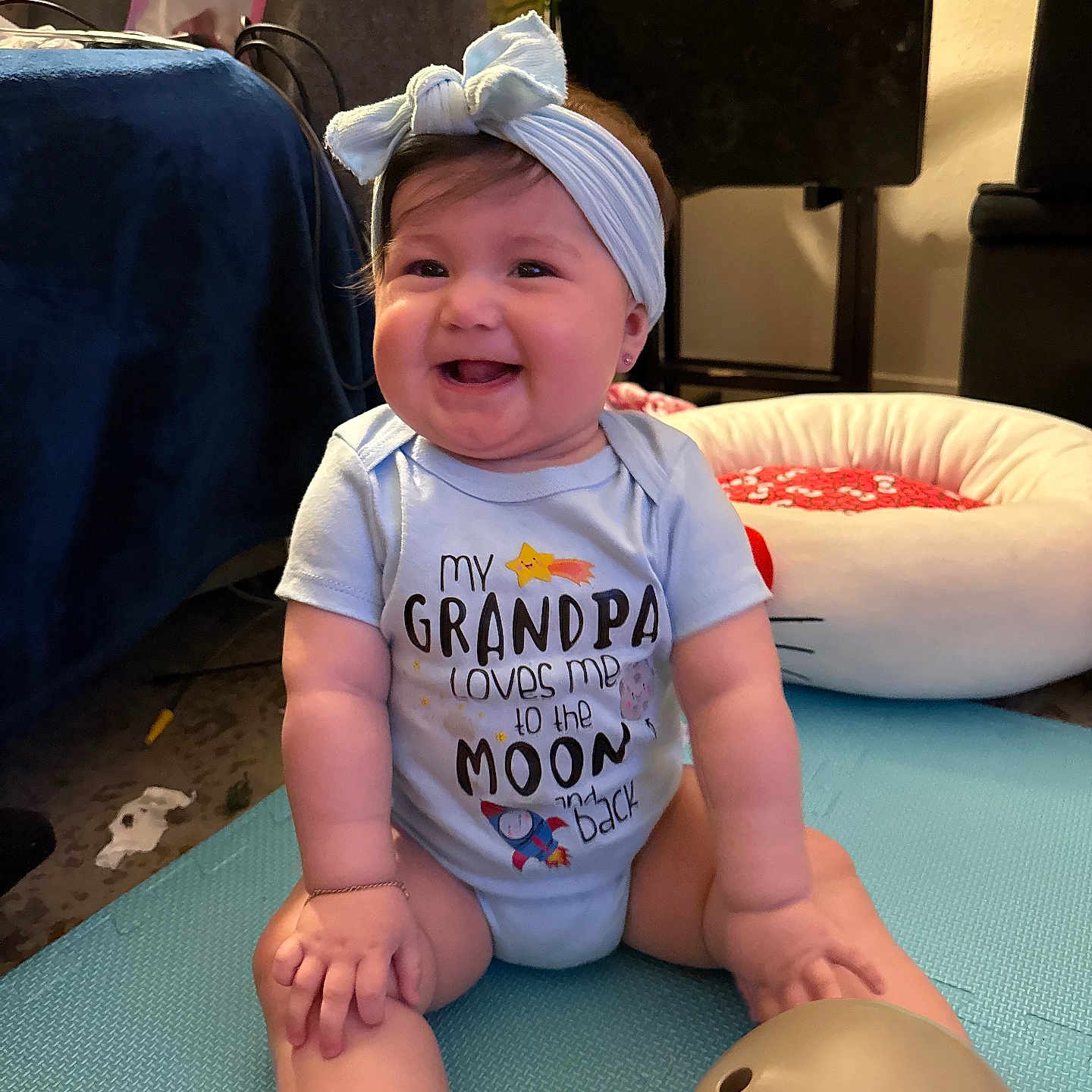 Lilliana joined the competition — help win amazing prizes! architecture, baby, building, clothing, couch, cushion, face, furniture, happy, head, homedecor, indoors, livingroom, person, photography, plant, portrait, pottedplant, room, t_shirt