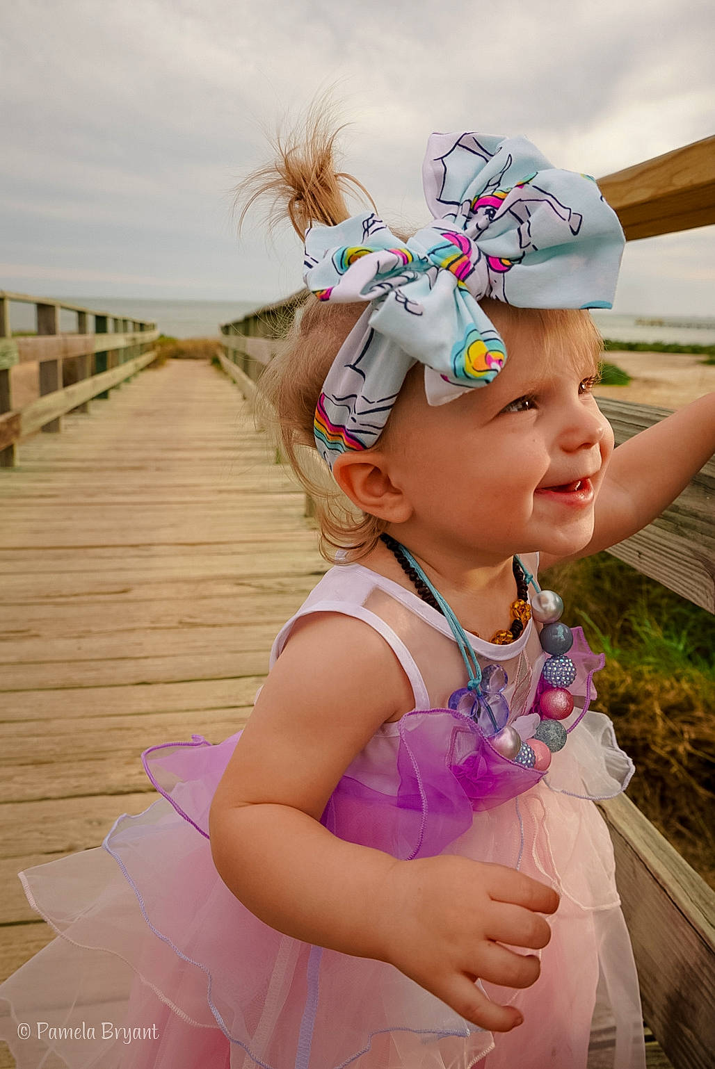 Keagan is registered to the contest to win money with this photo: child, costume, dress, fashion_accessory, fun, hair_accessory, happy, headgear, headpiece, headwear, person, photography, pink, smile, summer, toddler