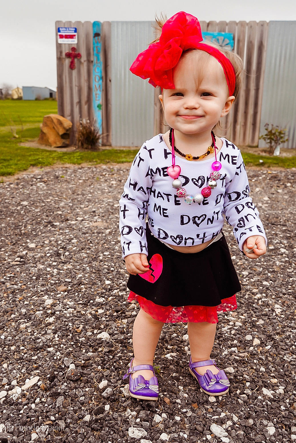 Keagan is registered to the contest to win money with this photo: baby_toddler_clothing, child, child_model, clothing, design, dress, fashion_accessory, footwear, headgear, headwear, joy, outerwear, pattern, person, pink, plant, play, shoe, sleeve, smile