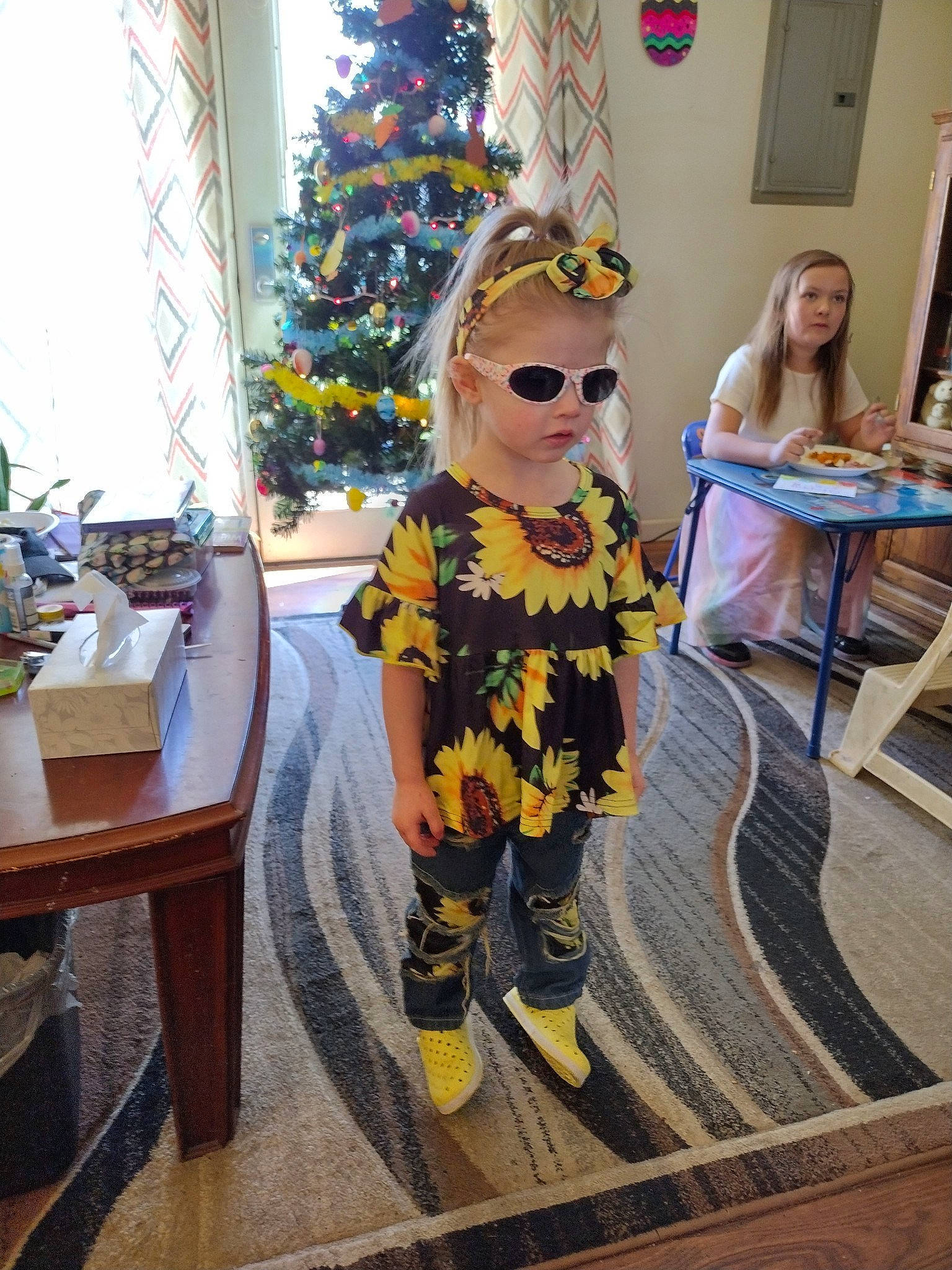 Raelynn joined the competition — help win amazing prizes! art, chair, child, christmas_tree, costume, event, eyewear, fashion_design, flooring, fun, glasses, goggles, leisure, person, room, sunglasses, table, toy, tree, vision_care