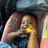 Aleiyah joined the competition — help win amazing prizes! baby, car_seat, child, smiling, toy, yellow_toy, pink_cushion, safety_warning, seatbelt, infant, happy, portrait, childhood, cute, indoors, person, closeup, hands, face, baby_clothing