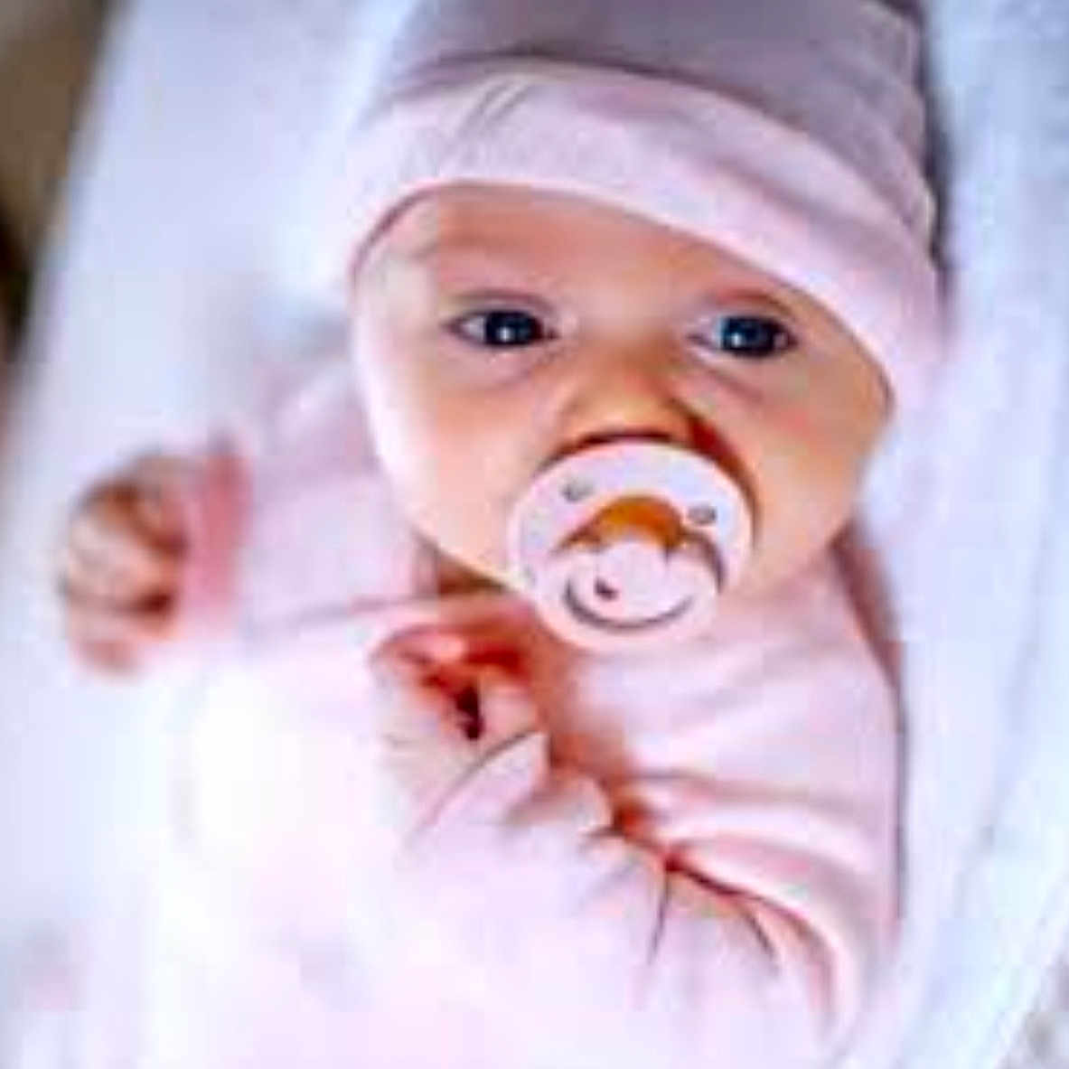 Lolo joined the competition — help win amazing prizes! baby, infant, pacifier, pink_clothing, hat, blanket, sleeping, closeup, face, cute, newborn, child, soft_light, indoor, resting, hands, portrait, cozy, young, person