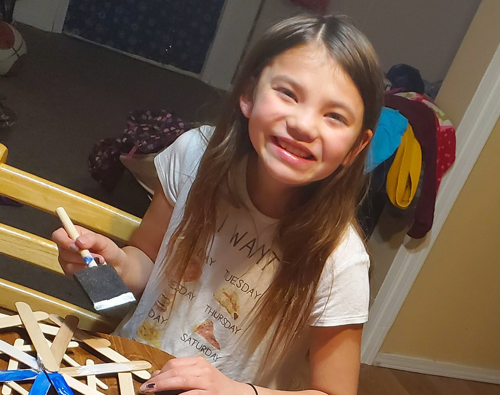 Avani is registered to the contest to win money with this photo: artist, chair, computer_keyboard, electronic_device, event, eyewear, fun, hand, happy, homework, human_leg, joy, long_hair, nail, necklace, office_equipment, office_supplies, person, sitting, smile