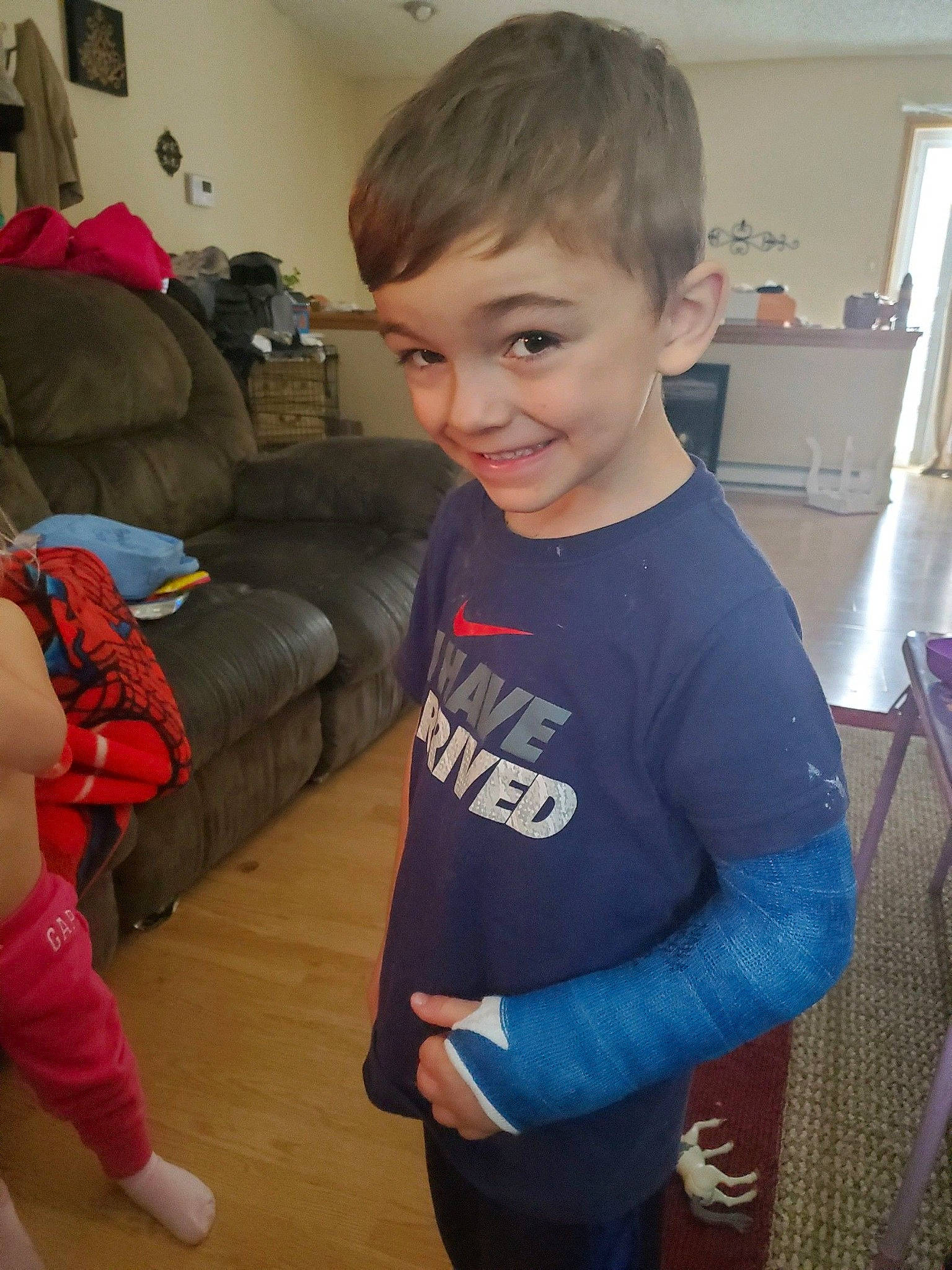 Sawyer joined the competition — help win amazing prizes! child, couch, facial_expression, floor, flooring, fun, hair, happy, hardwood, human_body, joint, joy, leg, living_room, person, shoulder, skin, sleeve, smile, standing