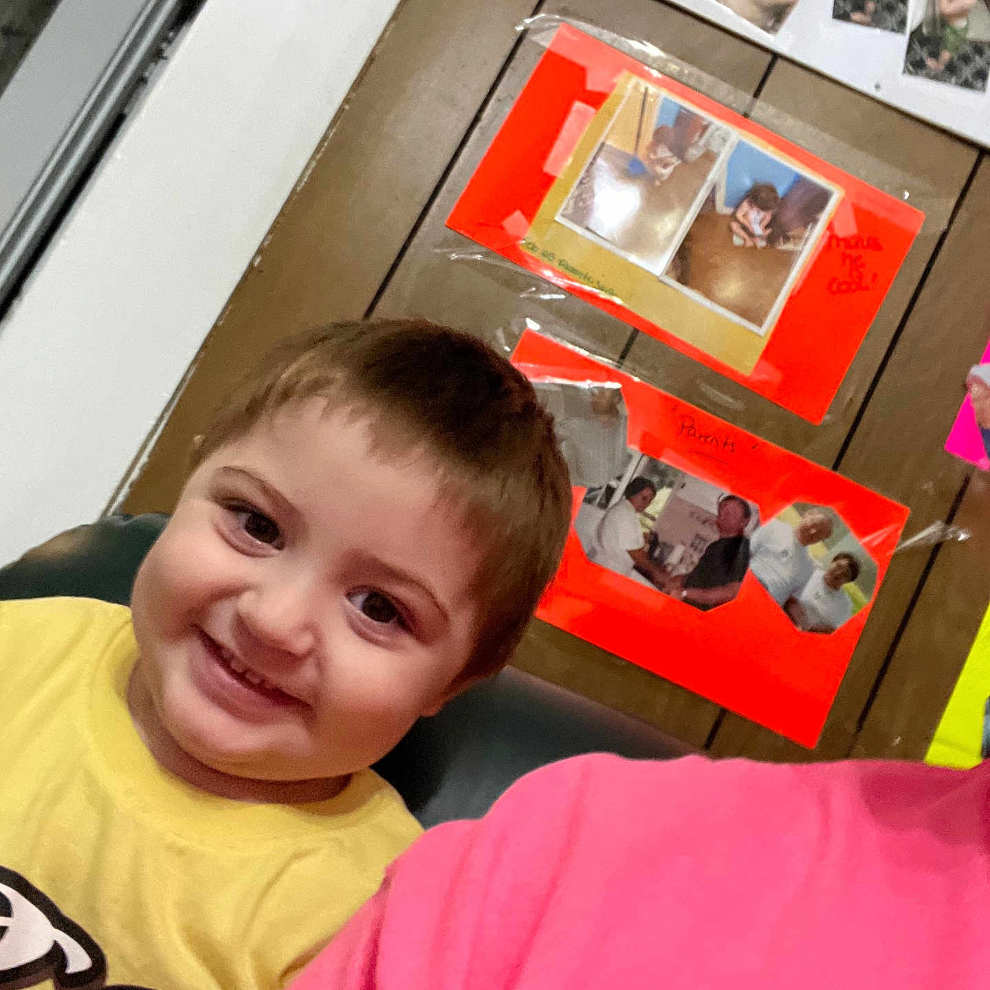 Kaycen joined the competition — help win amazing prizes! child, smiling, yellow_shirt, indoor, wood_panel_wall, photo_collage, happy, person, portrait, candid, home, casual, face, young_child, seated, colorful, wall_decor, family_photos, interior, people