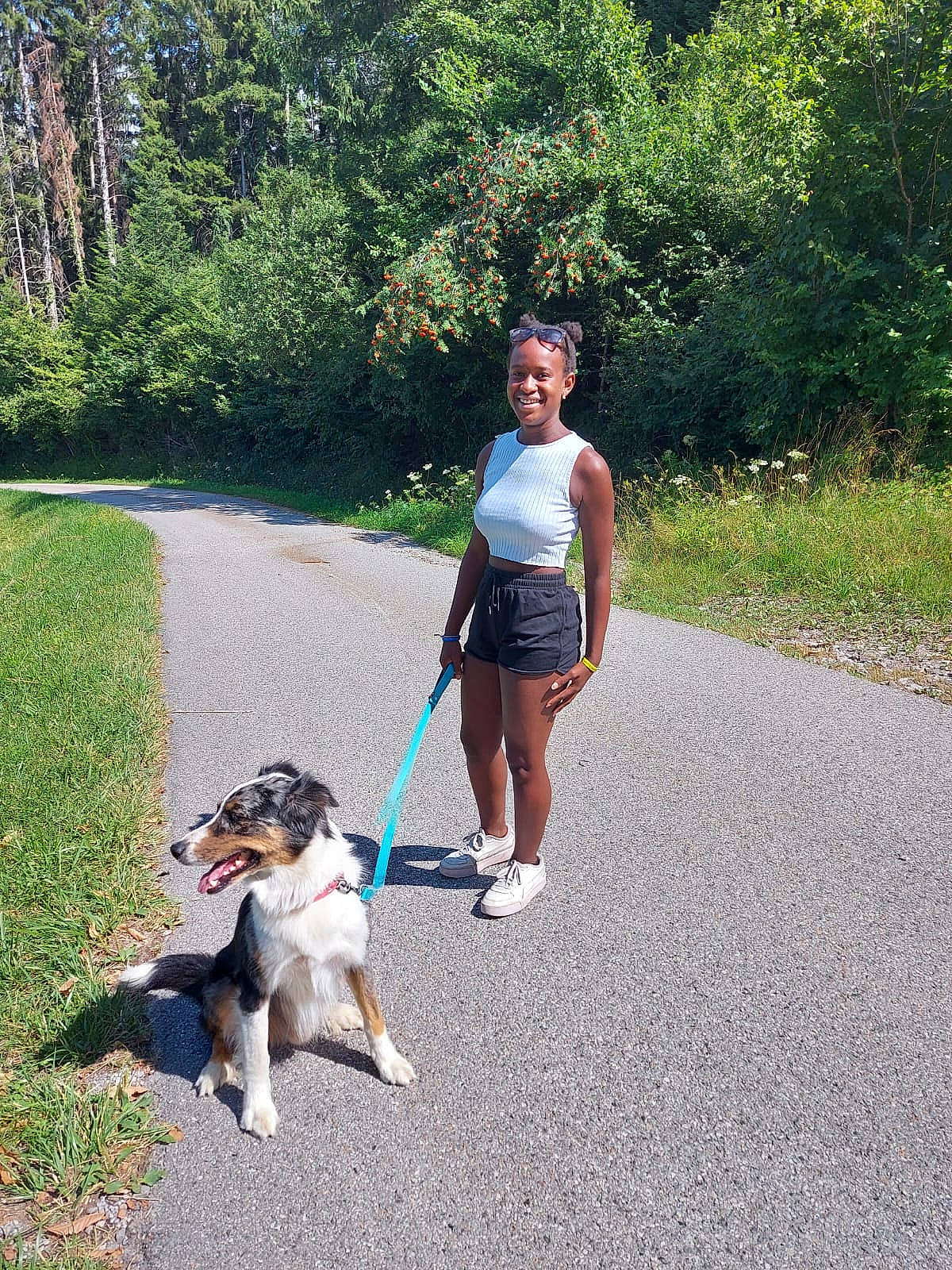 Angeline participe au concours pour gagner de l'argent avec cette photo : asphalt, carnivore, companion_dog, dog, dog_breed, fashion_accessory, fawn, grass, joy, leash, leisure, mammal, person, pet_supply, plant, recreation, sidewalk, smile, sporting_group, travel