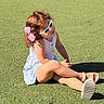 Kyla joined the competition — help win amazing prizes! child, girl, sunglasses, pink_bow, curly_hair, dress, striped_dress, grass, outdoor, sunlight, sitting, shoes, sandals, summer, cute, playful, smile, young, fashion, portrait