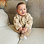 baby, child, couch, sweater, beige, smile, home, cozy, furniture, sitting, infant, cute, warm, blanket, cushion, portrait, person, indoor, comfortable, happy