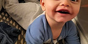 Reggie joined the competition — help win amazing prizes! baby, bed, blanket, bodypart, clothing, couch, crawling, crib, face, finger, furniture, hand, happy, head, infantbed, newborn, pants, person, photography, portrait