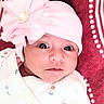 Seerat Kaur is registered to the contest to win money with this photo: baby, blanket, child, close_up, clothing, cute, eyes, face, floral, flower, headband, indoor, infant, looking_at_camera, lying_down, onesie, photography, pink, portrait, textile