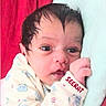 Seerat Kaur is registered to the contest to win money with this photo: baby, bedding, blanket, child, close_up, clothing, cuddly, eyes, face, fist, hand, indoor, infant, name, newborn, onesie, patterned, portrait, seerat, wide_eyed