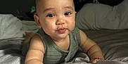Keadon joined the competition — help win amazing prizes! baby, child, infant, face, pout, bed, bedding, blanket, arm, skin, cute, expression, indoor, portrait, young, person, clothing, crawling, soft_light, cozy