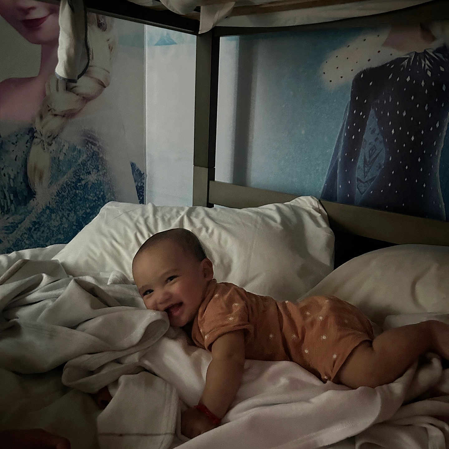 Keadon is registered to the contest to win money with this photo: baby, bed, bedding, blanket, child, clothing, comfort, cute, face, furniture, happy, indoor, infant, lying_down, person, portrait, sleepwear, smile, soft, toddler