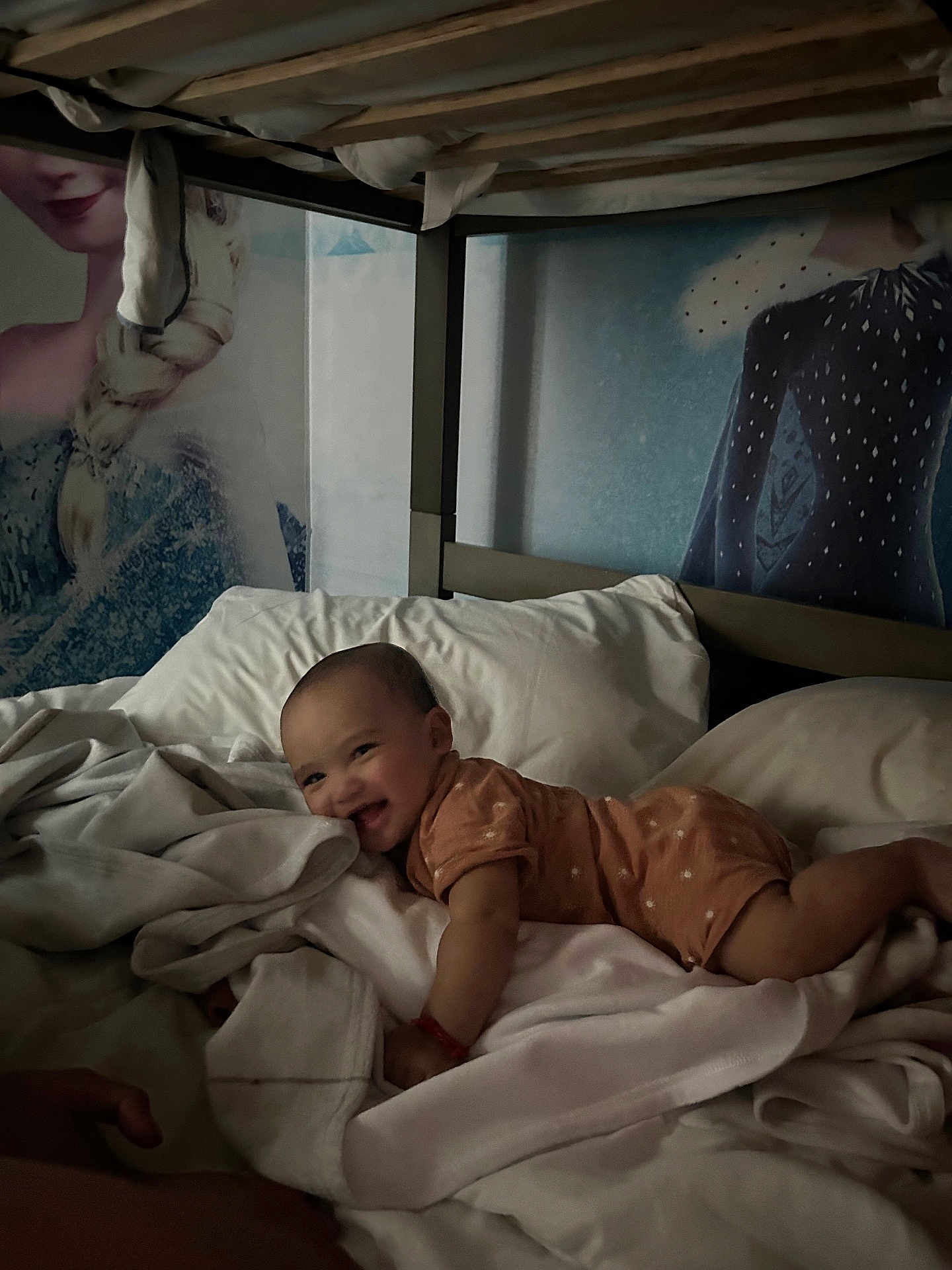 Keadon is registered to the contest to win money with this photo: baby, bed, blanket, bedding, child, clothing, comfort, cute, face, furniture, happy, indoor, infant, lying_down, person, portrait, sleepwear, smile, soft, toddler